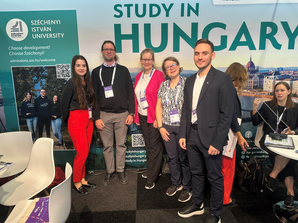 Kinga Kerpics (on the left) and Zoltán Ködmön (on the right) from Széchenyi István University with representatives from the Baden-Württemberg University in Germany at the Hungarian stand