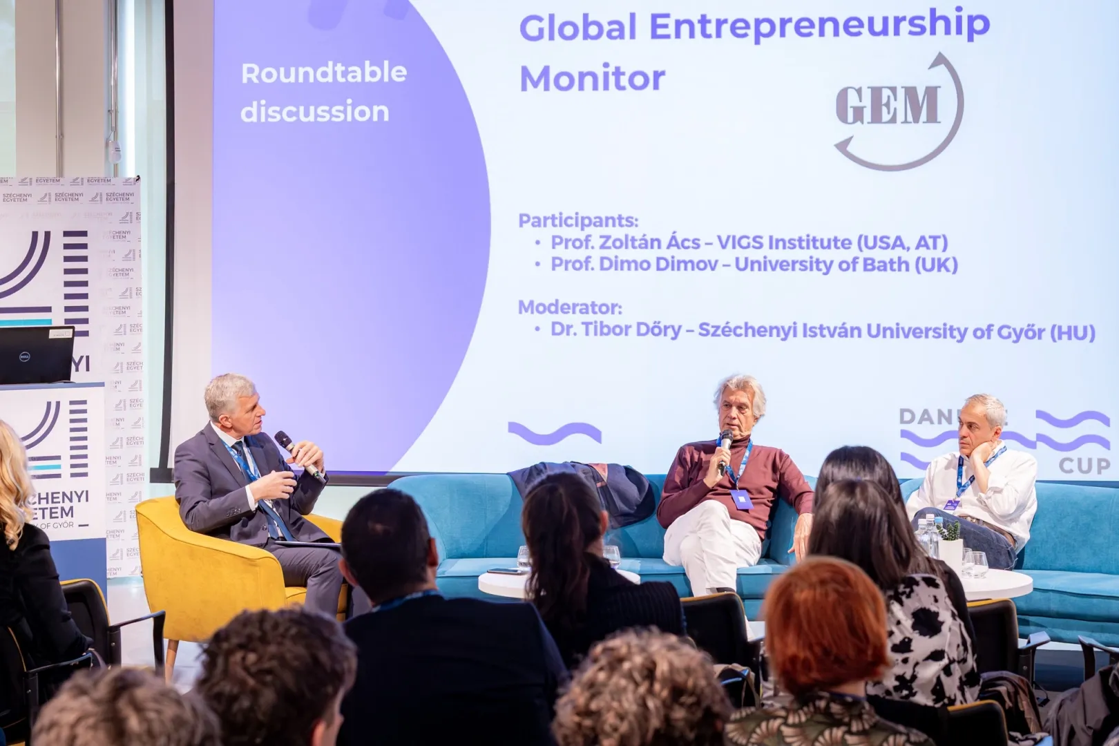 Conference participants engaged in roundtable discussions on entrepreneurship development. In the photo, Dr Tibor Dőry is seen in conversation with Professor Zoltán Ács and Professor Dimo Dimov (Photo: András Adorján)