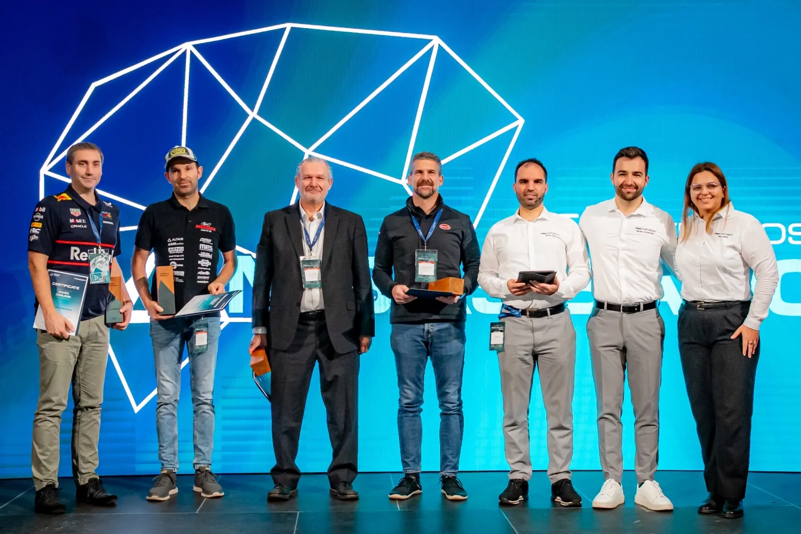 Recipients of the Formula Student Honorary Ambassador Award at the opening ceremony (from left to right): Owen Carless, Head of Mechanical Analysis & Reliability at Red Bull Powertrains; Markus Nenzel, Powertrain Group Leader at Nenzel Fahrzeugtechnik/UAS Esslingen; Claude Rouelle, vehicle dynamics expert and President of Optimum G; and Miroslav Zrnčević, Chief Test and Development Driver at Bugatti Rimac. Also pictured: János Kun (organiser), Dr Tamás Kolossváry (project supervisor) and Lilla Lugosi (project coordinator) (Photo: András Adorján) 