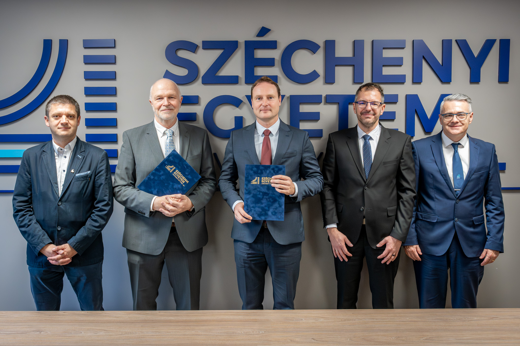 Participants at the signing ceremony: János Gyertyás, Director of Project Management at Green Energy Investhor Plc; Antal Ritter, CEO of the company; Dr. Bálint Filep, President of the University; Dr. András Torma, Head of the Department of Applied Sustainability; and Dr. Tamás Tóth, Research Professor and Dean of the Albert Kázmér Faculty of Agricultural and Food Sciences at Széchenyi István University. (Photo: András Adorján)