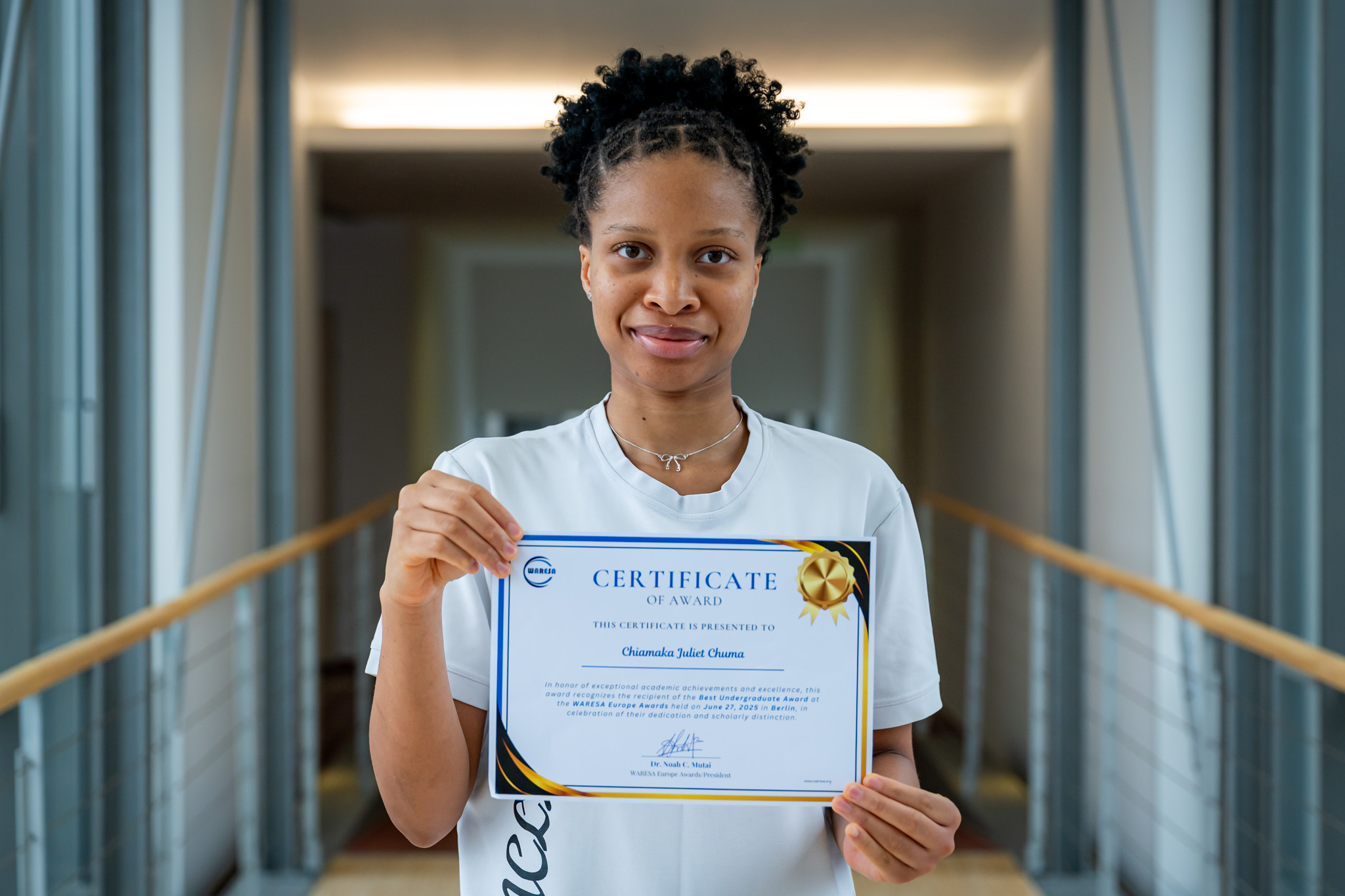 Széchenyi István University's Nigerian student, Chuma Chiamaka Juliet, with her certificate for Best Undergraduate Student (Photo: András Adorján)