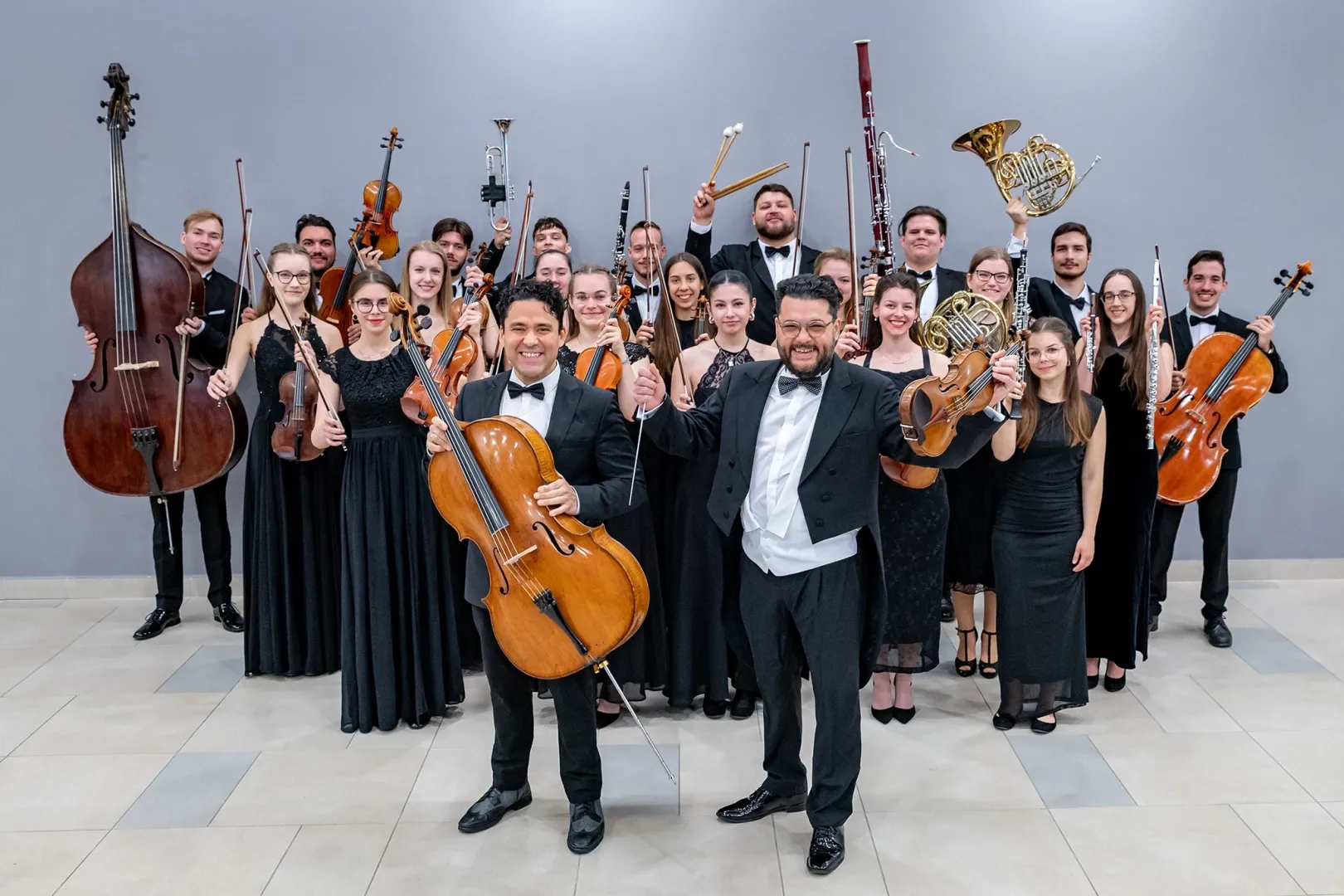 Ádám Jávorkai and Sándor Jávorkai (front) with members of the orchestra made up of students of Széchenyi István University. Ákos Bódai can be seen in the back row, third from the left (Photo: András Adorján)