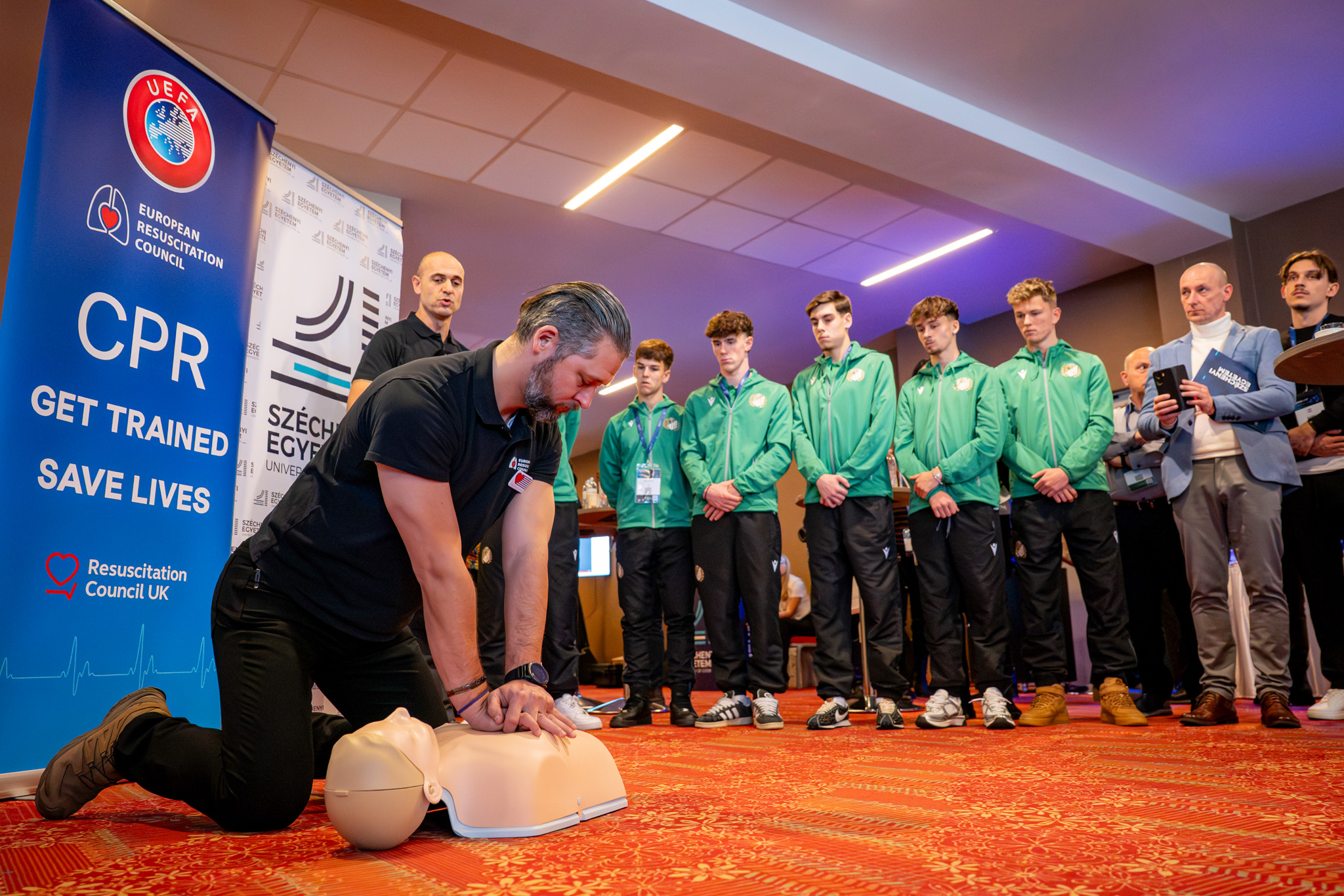 At the presentation of the UEFA Get Trained, Save Lives initiative, a resuscitation exercise was held, illustrating the importance of immediate intervention on sports fields and in everyday life. Young footballers from ETO FC also took part in the programme (Photo: András Adorján) At the presentation of the UEFA Get Trained, Save Lives initiative, a resuscitation exercise was held, illustrating the importance of immediate intervention on sports fields and in everyday life. Young footballers from ETO FC also took part in the programme (Photo: András Adorján)